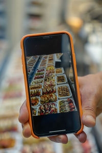 Close-up of hand holding smart phone