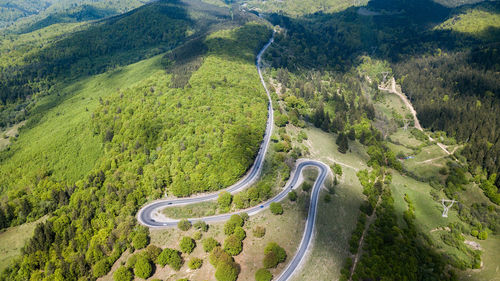 High angle view of winding road on land