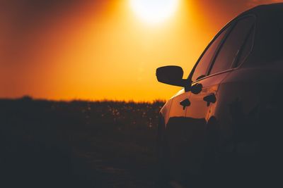 Silhouette of car at sunset