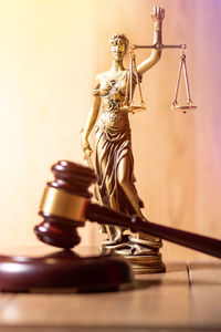 Lady justice with judge gavel in front