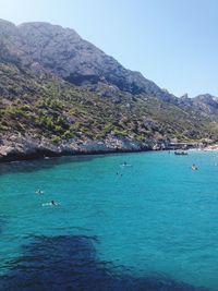 Scenic view of sea with mountains in background