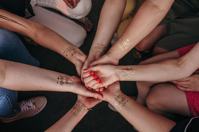 High angle view of people hands