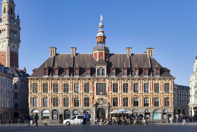 View of buildings in town against sky