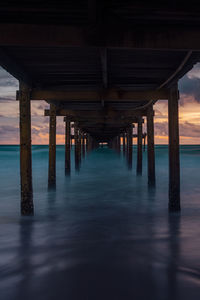 Pier over sea against sky