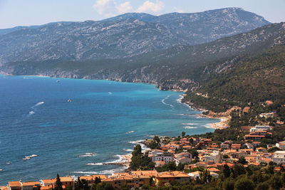 High angle view of townscape by sea