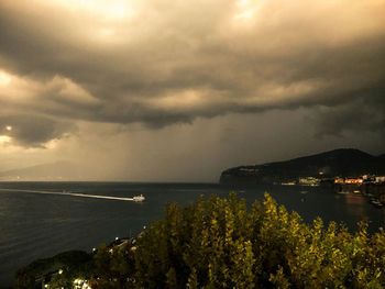 Scenic view of lake against dramatic sky