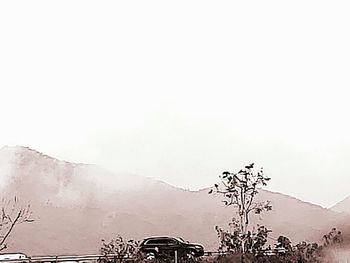 Scenic view of snowcapped mountains against clear sky