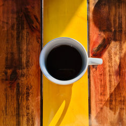 Directly above shot of coffee cup on table