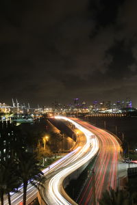 High angle view of light trails on highway at night