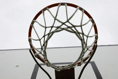 Low angle view of basketball hoop against sky