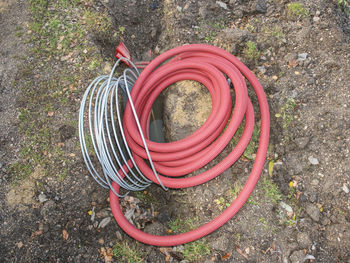 High angle view of red umbrella on land