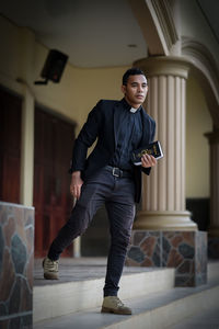 Full length of young man looking at camera