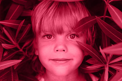 Portrait face candid happy little kid boy with problem allergic skin allergy. toned in viva magenta