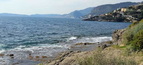 Scenic view of sea with mountains in background