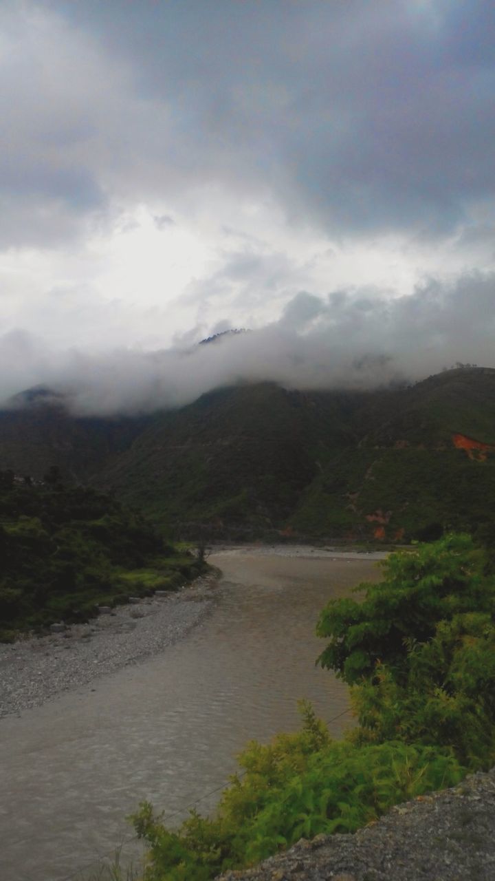 sky, cloud - sky, cloudy, mountain, tranquil scene, tranquility, scenics, water, beauty in nature, nature, tree, cloud, landscape, overcast, weather, mountain range, river, non-urban scene, idyllic, day