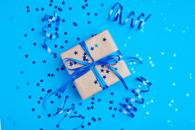 High angle view of christmas decorations on blue background