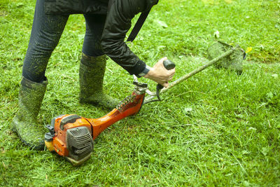 Low section of person wearing shoes on land