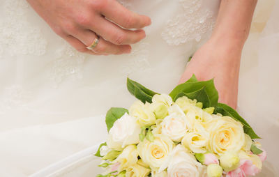 Cropped image of woman holding rose