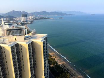 Scenic view of sea with mountain range in background