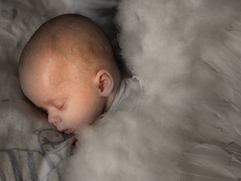 Cute baby sleeping on bed