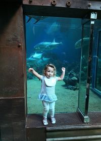 Full length of boy swimming in aquarium