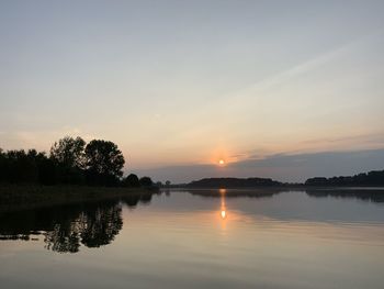 Scenic view of lake against sky during sunset