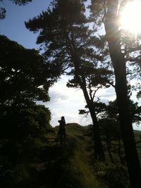 People walking on grassy landscape