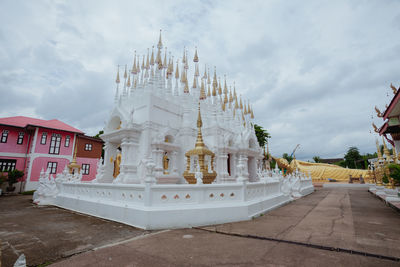 Low angle view of temple building against cloudy sky