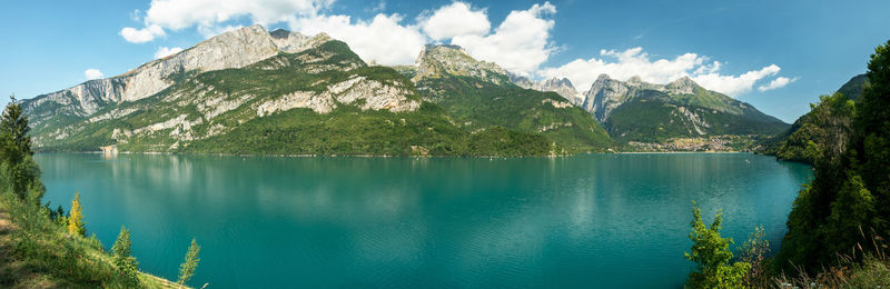 Scenic view of lake and mountains against sky