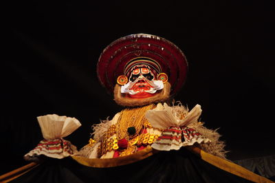 Close-up of birthday cake against black background