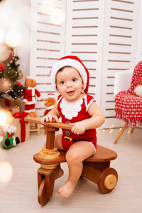 Cute girl sitting on tricycle