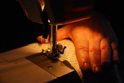 Close-up of person working on fabric