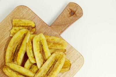 Close-up of bananas on white background