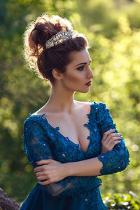 Close-up of young woman looking away outdoors