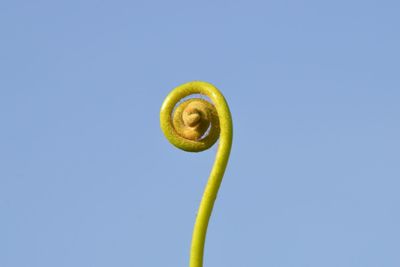 Low angle view of spiral against clear sky