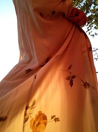 Low angle view of woman against sky