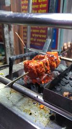 Close-up of meat on barbecue grill