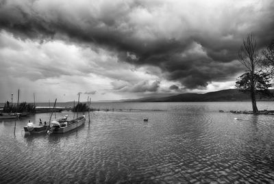 Sailboats on sea against sky