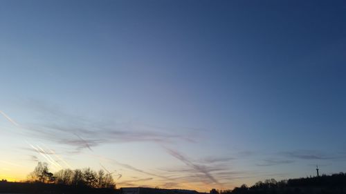 Silhouette landscape against sky during sunset