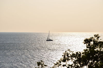 Scenic view of sea against clear sky during sunset