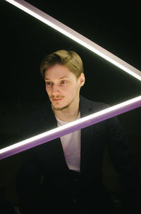 Portrait of young man looking at camera