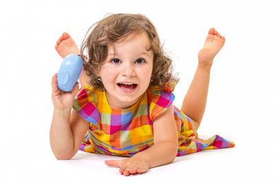 Portrait of a smiling girl over white background