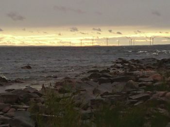 Scenic view of sea against cloudy sky