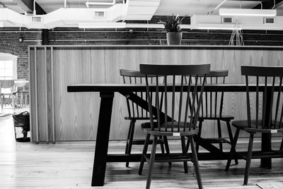 Empty chairs and tables in cafe