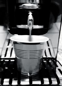 Close-up of coffee pouring in cafe