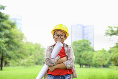 Portrait of man standing against plants