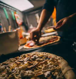 Midsection of person preparing food