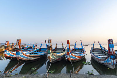 Boats moored at harbor