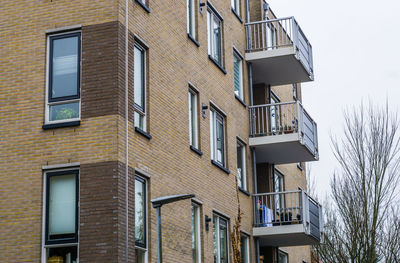 Low angle view of residential building against sky