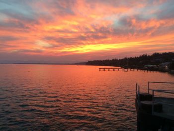 Scenic view of sea against orange sky